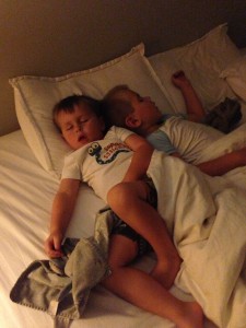 When dad's out of town, boys sleep with mom.  This is how I found them - cuddled up to each other.