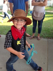 Parading cowboy is happier.  Note the lasso.