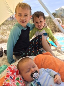 Three boys at the beach.  