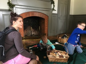 Playing with the simple colonial toys, by the fireplace