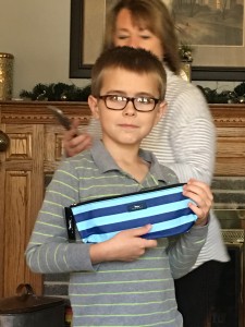 A non-fabulous photo of Jack showing off a toiletry bag he got as a gift