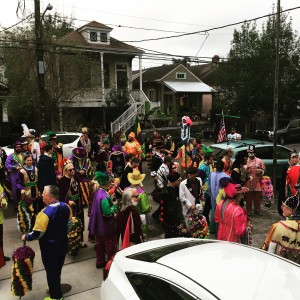 A crew in a walking parade (with one float) rolls right by our house - this is from my front porch on Mardi Gras day! That's my white car!
