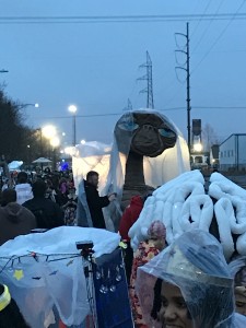 E.T., wearing a poncho at this time to keep him from dissolving in the rain, and later sporting a jester hat.  Also, the brain in front of him was part of a krewe of people who all wore elaborate brain hats.  I can't do it justice with words, but it was amazing.
